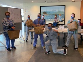 Workers in a health-care facility near VGH get a meal from Feed the Frontline.