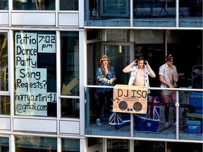 Harry Curtin, 28, and two roommates who live in a condo at Main and 7th in Vancouver, BC, have started playing music from their balcony each evening following the 7 p.m. applause for health-care workers.