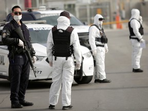 Members of traffic police wearing protective suits are seen during the coronavirus disease (COVID-19) outbreak at the Mexico and United States border in Ciudad Juarez, Mexico March 29, 2020.
