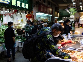 People wear masks in a wet market in Hong Kong on Feb. 2.