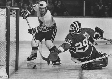 Bobby Lalonde of the Vancouver Canucks swoops in on Montreal Canadiens goalie Ken Dryden in National Hockey League playoff action on April 19, 1975. The puck went wide and the Canucks lost the game 4-0. Ralph Bower/Vancouver Sun.