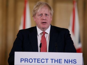 Prime Minister Boris Johnson speaks during a news conference on the ongoing situation with the coronavirus disease in London March 22, 2020. (Ian Vogler/Pool via REUTERS/File Photo)