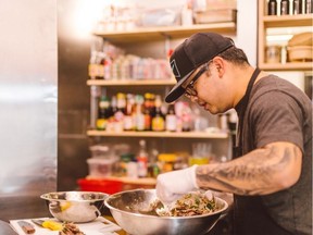Chef Tang Phoonchai prepares food at Vancouver's Thai restaurant Kin Kao in a handout photo. The restaurant now relies on delivery apps for 50 to 60 per cent of its sales, up from 10 to 12 per cent as physical distancing measures due to COVID-19 have halted dine-in service.
