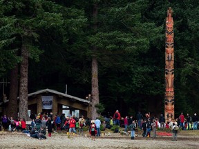 The Gwaii Haanas legacy totem pole is seen after being raised in Windy Bay, B.C., on Lyell Island in Haida Gwaii on August 15, 2013. As the COVID-19 pandemic forces remote British Columbia communities to close their borders to outsiders, Indigenous tourism companies along the coast say the federal government is leaving them behind. Tours for Haida Gwaii are normally booked well in advance due to high demand and the quota system placed on the area. The remoteness of the region also means it has a shorter tourism high season than other locations in the province.