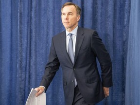 Federal Finance Minister Bill Morneau arrives for a news conference in Toronto on Wednesday April 1, 2020.