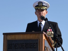 Captain Brett Crozier addresses the crew for the first time as commanding officer of the aircraft carrier USS Theodore Roosevelt during a change of command ceremony on the ship's flight deck in San Diego, California, U.S. November 1, 2019.