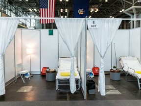 Improvised hospital rooms are seen at the Jacob K. Javits Convention Center, in New York City, which has been partially converted into a hospital for patients affected by the coronavirus disease.