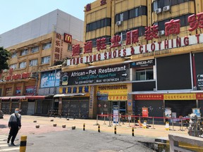 An African restaurant is closed off along with other businesses in Guangzhou's Sanyuanli area, where a neighborhood is in lockdown after several people tested positive for the novel coronavirus disease (COVID-19), in Guangdong province, China April 13, 2020.