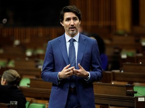 Canada's Prime Minister Justin Trudeau speaks in the House of Commons as legislators convene to give the government power to inject billions of dollars in emergency cash to help individuals and businesses through the economic crunch caused by the coronavirus disease (COVID-19) outbreak, on Parliament Hill in Ottawa, Ontario, Canada April 11, 2020.