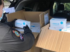 Delta police say it was “troubling” to catch two people this week allegedly reselling boxes of respirators and surgical masks at highly inflated prices.