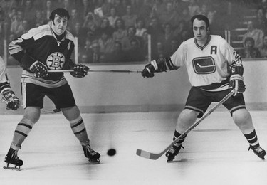 Vancouver Canucks defenseman Gary Doak holds the stick of Boston Bruins star Phil Esposito during a March 13, 1971 game at the Pacific Coliseum. The Sun's cutline was "For a moment, Doak hold the hottest stick in the land." Esposito "objected strenuously" to Doak's manoeuvre to referee Ron Wicks, but to no avail. But Boston won anyway, 6-3. Ralph Bower/Vancouver Sun.