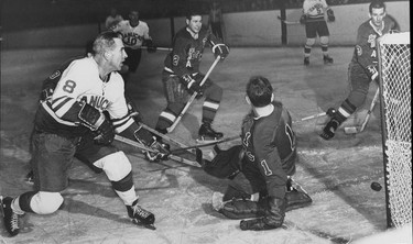 Vancouver Canucks legend Phil Maloney (left) in action against the Seattle Totems at the Forum in the 1960s. Maloney was the top Canucks player when they were in the Western Hockey League. Ralph Bower/Vancouver Sun