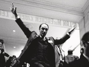Ted Grant's famous shot of Pierre Trudeau sliding down a banister at the 1968 Liberal convention in Ottawa.