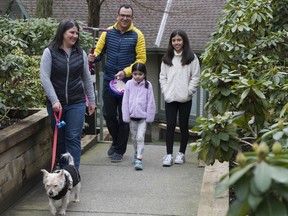 Lino Coria with wife Marcela de la Pena, with daughters Emilia (in pink) and Julia at their home in Port Moody.