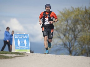 A jogger at Vanier Park in Vancouver, B.C., Saturday, April 18, 2020. The 36th annual Sun Run was supposed to take place on Sunday but it was cancelled leaving many runners joining virtual races, where they sign up online, run solo, and then post their times.