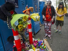 Flowers mark the spot at Hastings and Main streets in Vancouver, BC Thursday afternoon April 23, 2020 where a baby was found deceased inside a portable toilet late Wednesday. Police are investigating.