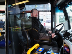 Nelson McCabe demonstrates the new bus barriers in New Westminster on Jan. 28, 2015.
