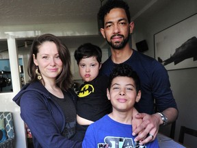 Allister Foster, a freelance photographer, with wife Tarah and sons Miles and Reilly, front, believes the family can get through the pandemic with the financial assistance offered by government. Not everyone will be as lucky, he fears.