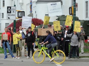 A group protesting COVID-19 restrictions gathered in Kitsilano on Sunday. Susan Standfield is standing on the left in the yellow t-shirt.