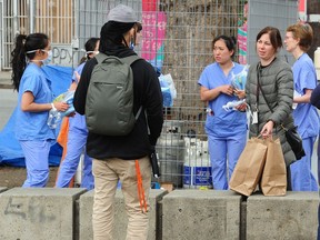 Health care workers helping residents of the Downtown Eastside's Oppenheimer Park.