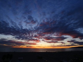 The sun sets over the Pacific Ocean as the most recent in a series of storms passes through Southern California, seen from Palisades park in Santa Monica, Calif., Monday, Dec. 30, 2019. We've saved the whales, more or less. Now, scientists say we have a chance to save the rest of the life in the oceans, just by expanding what's already happening around the globe.THE CANADIAN PRESS/AP Photo/Reed Saxon
