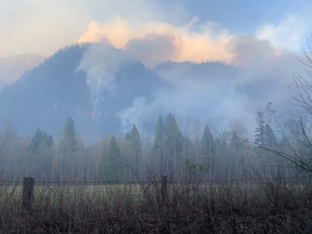 The wildfire has jumped from the south side of Squamish Valley Road at Magee Road to the north side, making the road impassable, and the fire is moving quickly in dry conditions