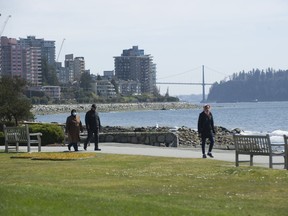 Walkers along the seawall in West Vancouver at Dundarave Park. Maintaining social distance of at least two metres (six feet) from people outside your household and washing your hands is how to protect you, your family and others from spreading the new coronavirus.