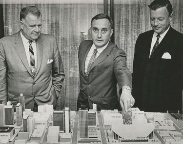 Left to right: Toronto Maple Leafs owners Harold Ballard and Stafford Smythe show the design of their proposed downtown hockey arena to the Vancouver media on Aug. 19, 1964. Vancouver Mayor Bill Rathie (right) supported the plan, which would have seen a 20,000 arena built on West Georgia where the CBC and Vancouver Public Library are today. Vancouver council offered Ballard and Smythe a 99 year lease on the property, but the Leafs owners rejected it because they wanted the land outright. A plebiscite was held on whether to give Smythe and Ballard the property, and voters rejected it on Dec. 9, 1964. Deni Eagland/Vancouver Sun