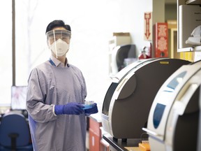 Medical Laboratory Technologist, Nai Jun Zhu working in a VCH lab.
