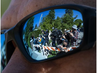 VANCOUVER, BC - MAY 27: The crowd of media waiting for Meng Wanzhou to leave her home is seen in the reflection of a security guard posted outside the home on May 27, 2020 in Vancouver, Canada. Meng a Huawei executive is fighting extradition to the United States and has been under house arrest in Vancouver for almost a year and a half.