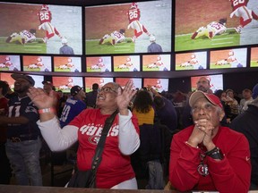 Fans of the San Francisco 49ers watch as Kansas City Chiefs' Damien Williams scores a touchdown during the second half of Super Bowl 54 on Sunday, Feb. 2, 2020, at Tom's Watch Bar in Los Angeles.