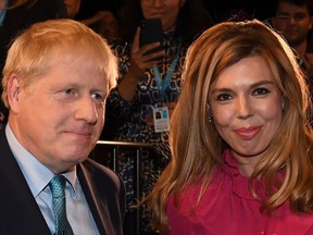 British Prime Minister Boris Johnson with his fiancee Carrie Symonds in October 2019 at the annual Conservative Party conference in Manchester, England.