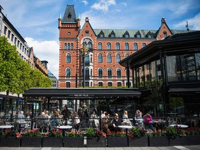 People sit in a restaurant in Stockholm.