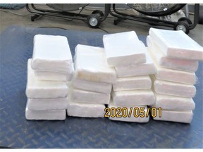 One person has been arrested after border officials in Canada seized 20 bricks of suspected cocaine from a tractor trailer at the Pacific Highway border crossing.