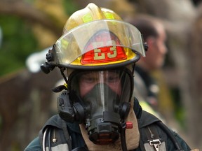 A Victoria firefighter  in full protective gear. Despite advances in protection, cancer is a major killer of firefighters.