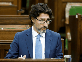 Prime Minister Justin Trudeau waits for a meeting of the special committee on the COVID-19 pandemic to begin in the House of Commons, May 13, 2020.