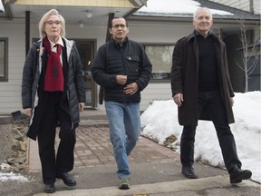 Wet'suwet'en hereditary leader Chief Woos, also known as Frank Alec, centre, Minister of Crown Indigenous Relation, Carolyn Bennett, left, and B.C. Indigenous Relations Minister Scott Fraser talk to the media in Smithers, B.C., on March 1, 2020.