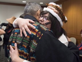 Chief Marilyn Slett receives a hug following a news conference in Vancouver, Wednesday, Oct. 10, 2018.