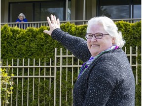 Diane Barnhill waves to her mother Anna Hendrickson, 97, outside the Lynn Valley Care Centre in a file photo from May 2020.