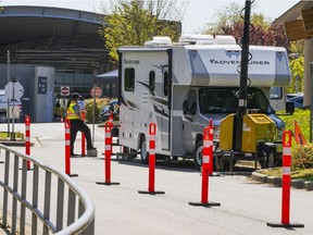 Officers tasked with COVID-19 checks work at Peace Arch Border Crossing, Surrey, British Columbia.