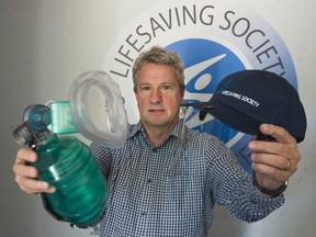 Dale Miller, executive director of the Lifesaving Society, B.C. & Yukon, holds the 'bag-valve-mask' and face shield that lifeguards will use instead of performing mouth-to-mouth during a rescue.