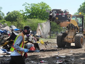 City of Vancouver workers clear Oppenheimer Park after the tent city was emptied during the COVID-19 pandemic in Vancouver on May 10, 2020.