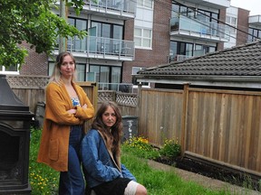 Deuphine Apedaile, right, and Cassy Conley, who sunbathed topless in their back yard and are getting harassed about it.