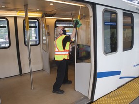 A cleaner demonstrates new procedures for disinfecting SkyTrain cars on Thursday.