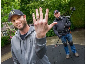 Aaron Martinello with the wedding band that detectorist Dave Rosychuk found on the PNE grounds six years after it was originally lost.