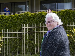 Diane Barnhill waves to her mom Anne Hendrickson, who is a resident at the Lynn Valley Care Centre