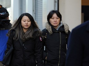 Xiaoning Sui (R) leaves the federal courthouse after entering a plea in connection with a nationwide college admissions cheating scheme in Boston, Massachusetts, U.S., February 21, 2020.