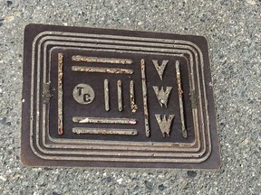 A Vancouver water works grate bearing the Terminal City Iron Works stamp, at Vernon Drive and Keefer Streets.