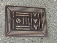 A Vancouver water works grate bearing the Terminal City Iron Works stamp, at Vernon Drive and Keefer Streets.