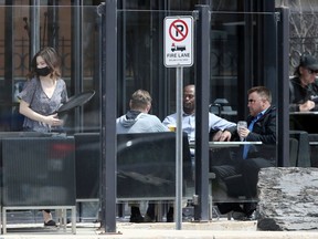 Customers on the patio at Earl's restaurant on Portage Avenue in Winnipeg on May 5, 2020.